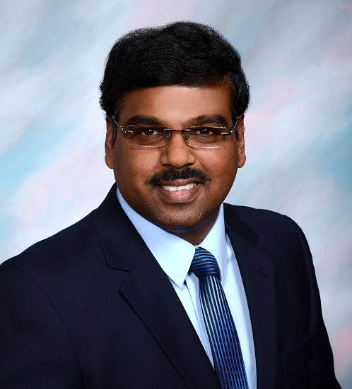 A man wearing a suit and tie