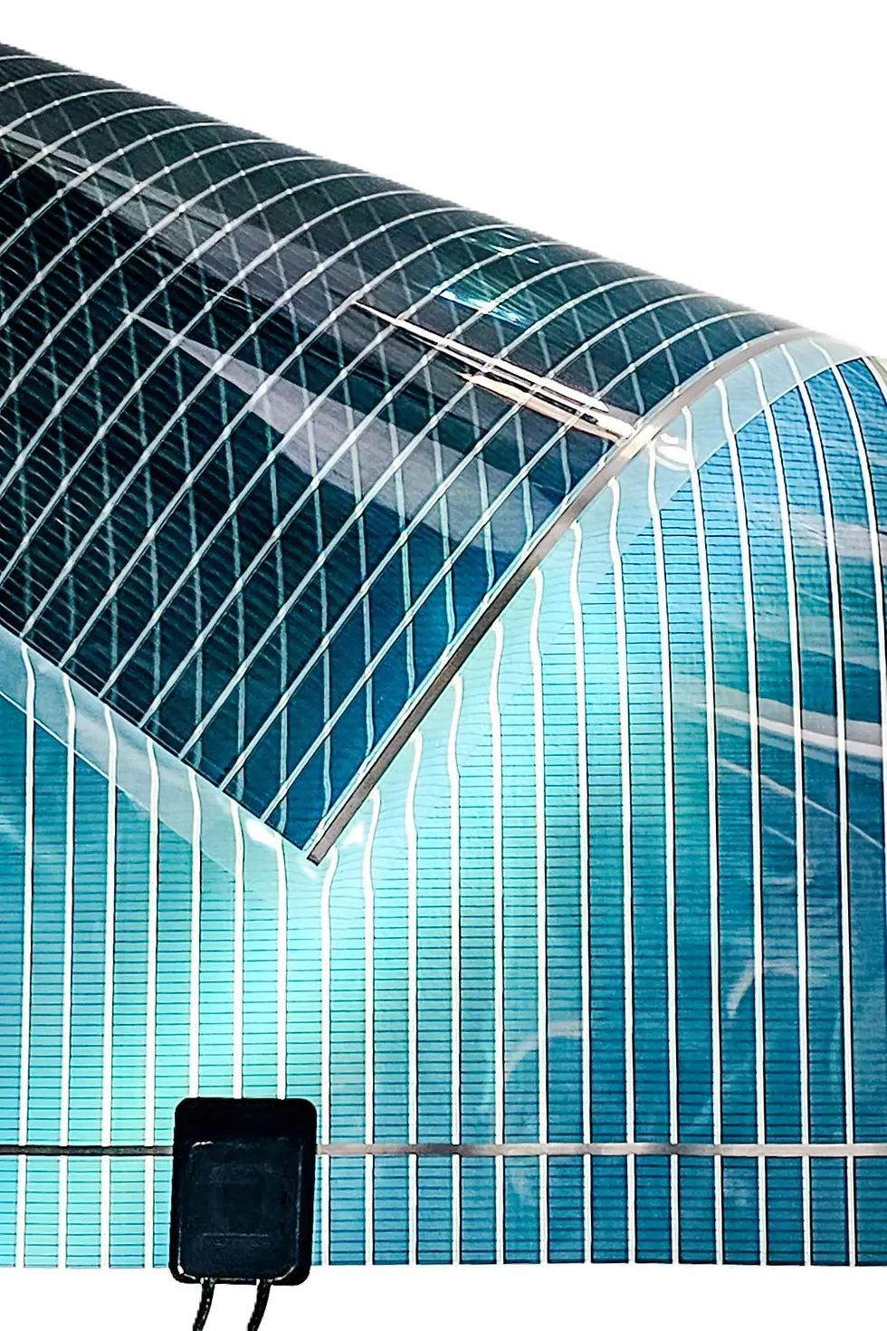 
Brilliant Matters produces advanced, eco-friendly organic semiconductor materials used to manufacture lightweight, flexible, and semi-transparent Organic Photovoltaic (OPV) panels. Unlike conventional silicon-based photovoltaic technology, OPV panels are produced using advanced material inks that can be printed through roll-to-roll manufacturing processes, similar to newspaper printing. (Image: Brilliant Matters)
